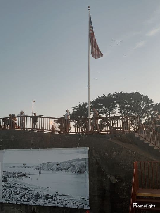 American flag flying at a lookout at dusk